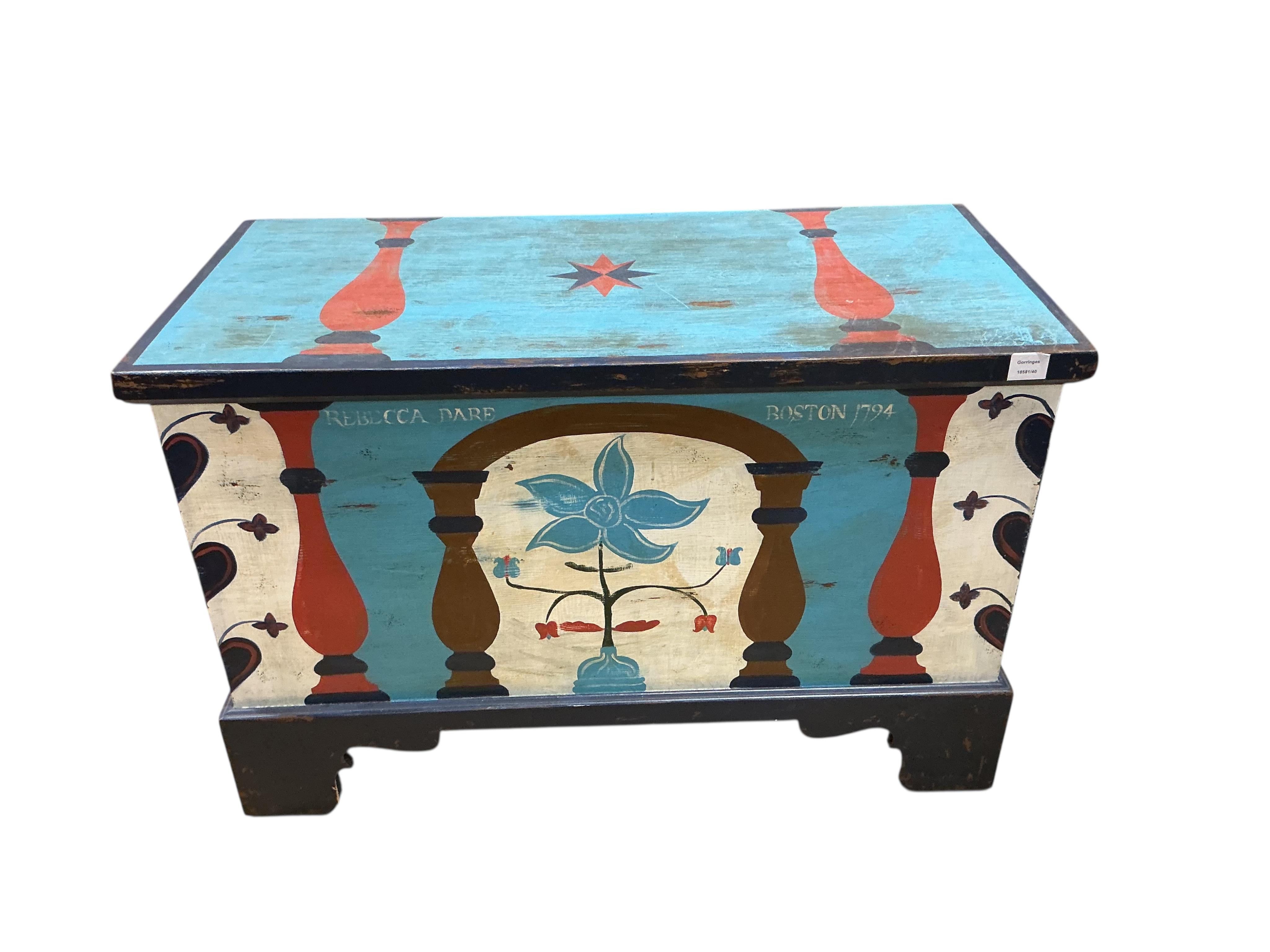 A painted chest, floral decorated and inscribed, width 102cm, depth 49cm, height 67cm